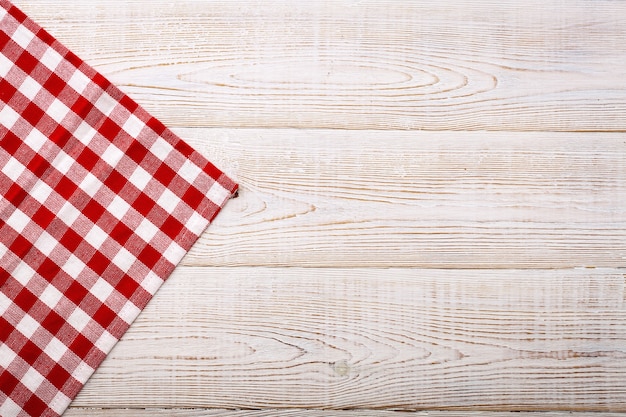 Premium Photo | Empty red table cloth on wooden table top view mockup.