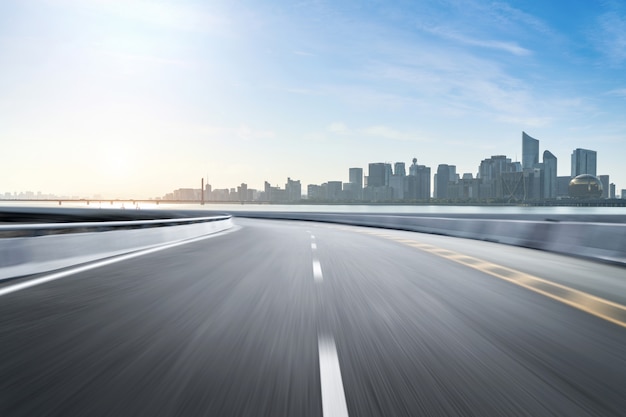 Empty road floor surface with modern city landmark buildings Photo ...