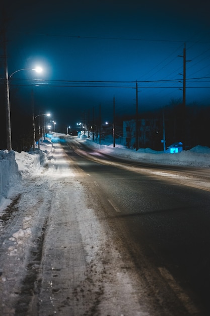 Free Photo | Empty road with snow at noght