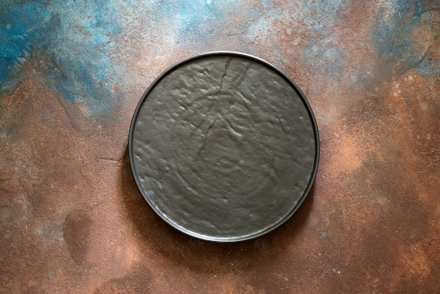 Premium Photo | Empty rustic black stone plate on dark concrete