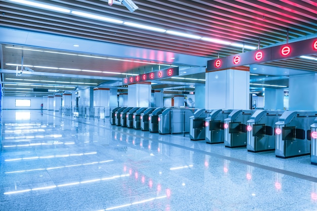 Empty subway station with red lights Free Photo