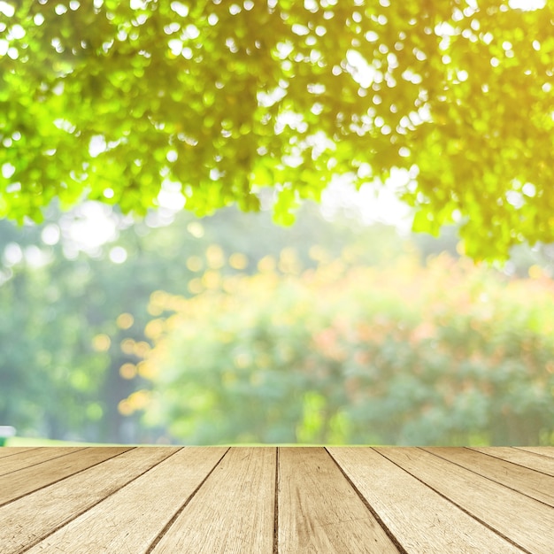 Premium Photo | Empty table, perspective wood over blur tree with bokeh ...