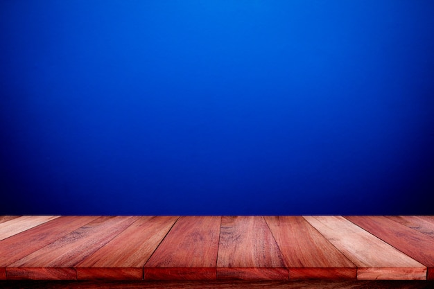 Premium Photo | Empty wooden table with blue wall texture background