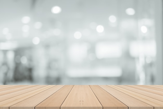 Premium Photo | Empty wooden table with blurred background,free space
