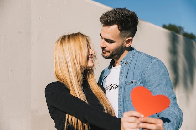 Free Photo | Enamored man and woman with paper heart