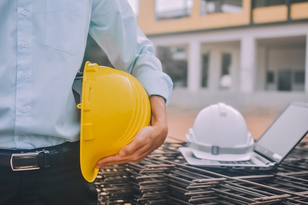 Premium Photo | Engineer at the construction site with hard hat