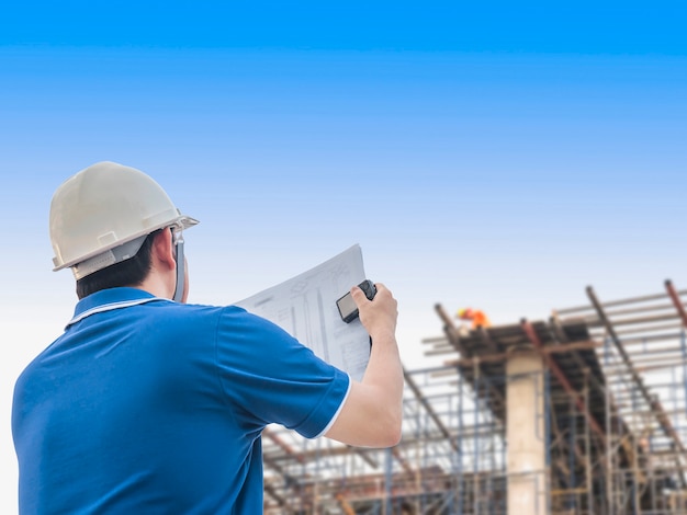 Engineer is inspecting his work in building construction site Free Photo