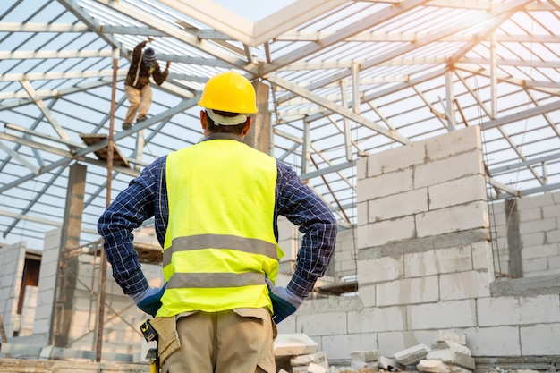 Premium Photo | Engineer technician looking up and analyzing an ...