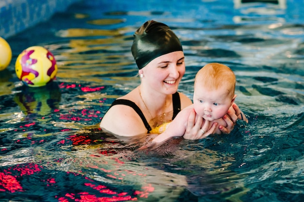 Premium Photo | Enjoy the first day of swimming in the water.