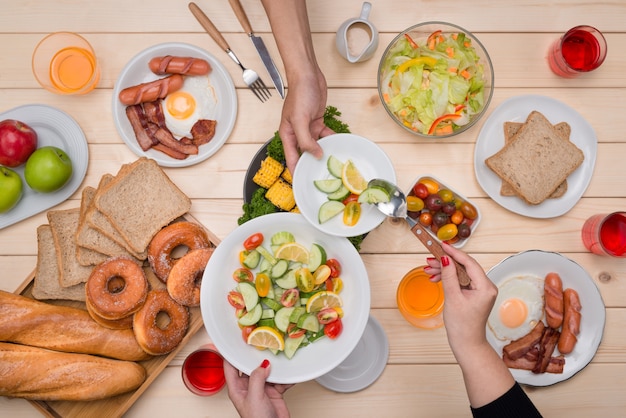 Premium Photo | Enjoying dinner with friends. top view of group of ...