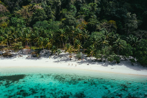 Premium Photo | Enjoying the time at the beach. people walking on the ...