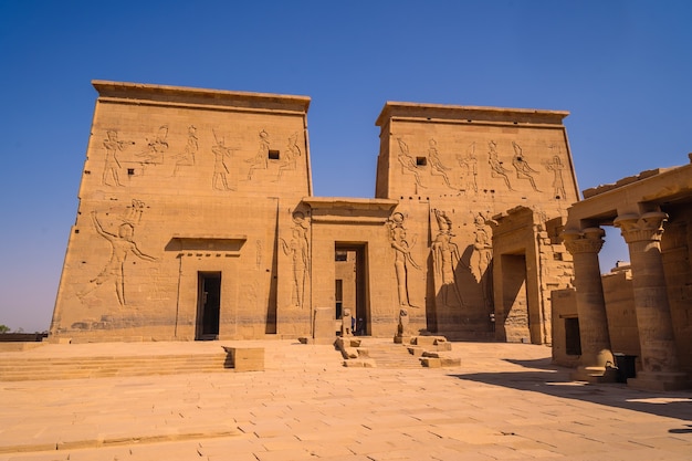 Premium Photo | Entrance with beautiful pharaohs in the temple of ...