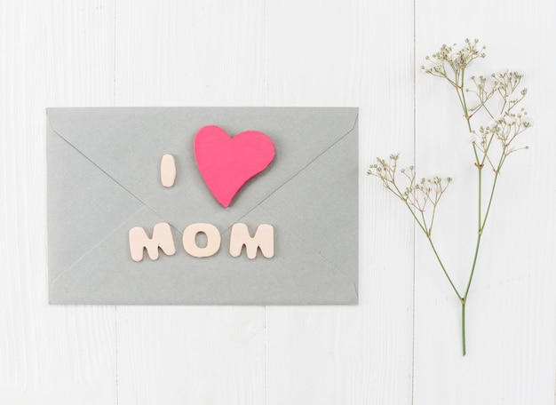 Free Photo | Envelope for mother`s day with branch gypsophila