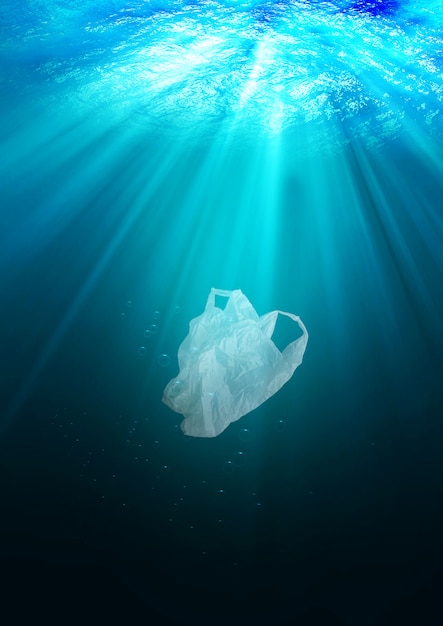 Environmental protection concept. plastic bag pollution in ocean Premium Photo