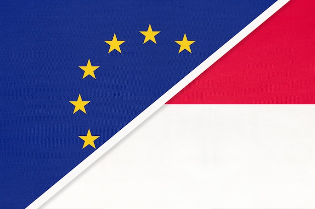 欧州連合またはeu対モナコの国旗 プレミアム写真