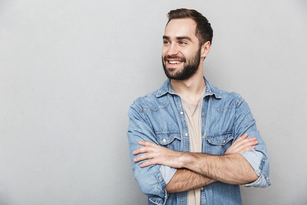 Premium Photo Excited Cheerful Man Wearing Shirt Isolated Over Gray Wall Arms Folded 4664