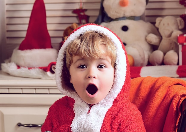 Premium Photo | Excited christmas for funny amazed child boy winter ...