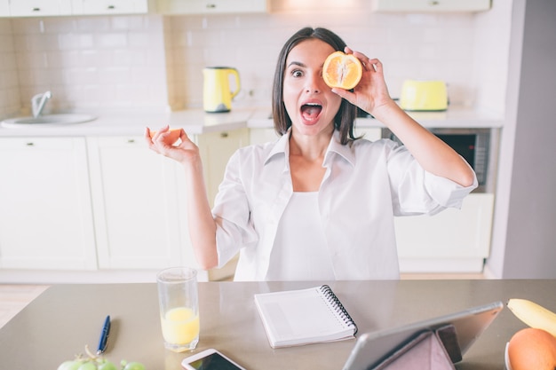 Premium Photo | Excited girl is posing with fruit