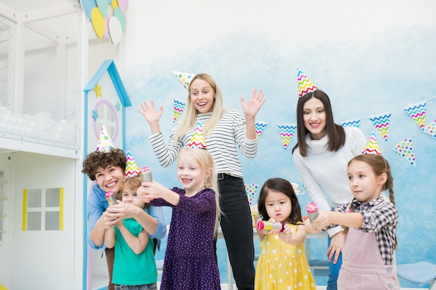 Excited Mothers Having Fun With Kids At Birthday Party Premium Photo