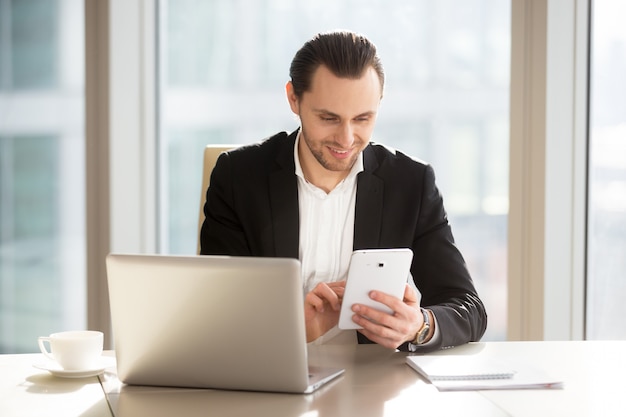 Executive manager using mobile app for banking Free Photo