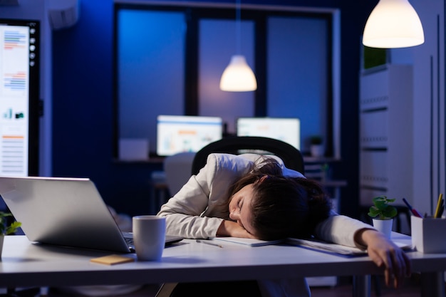 Premium Photo | Exhausted overload business woman falling asleep on ...