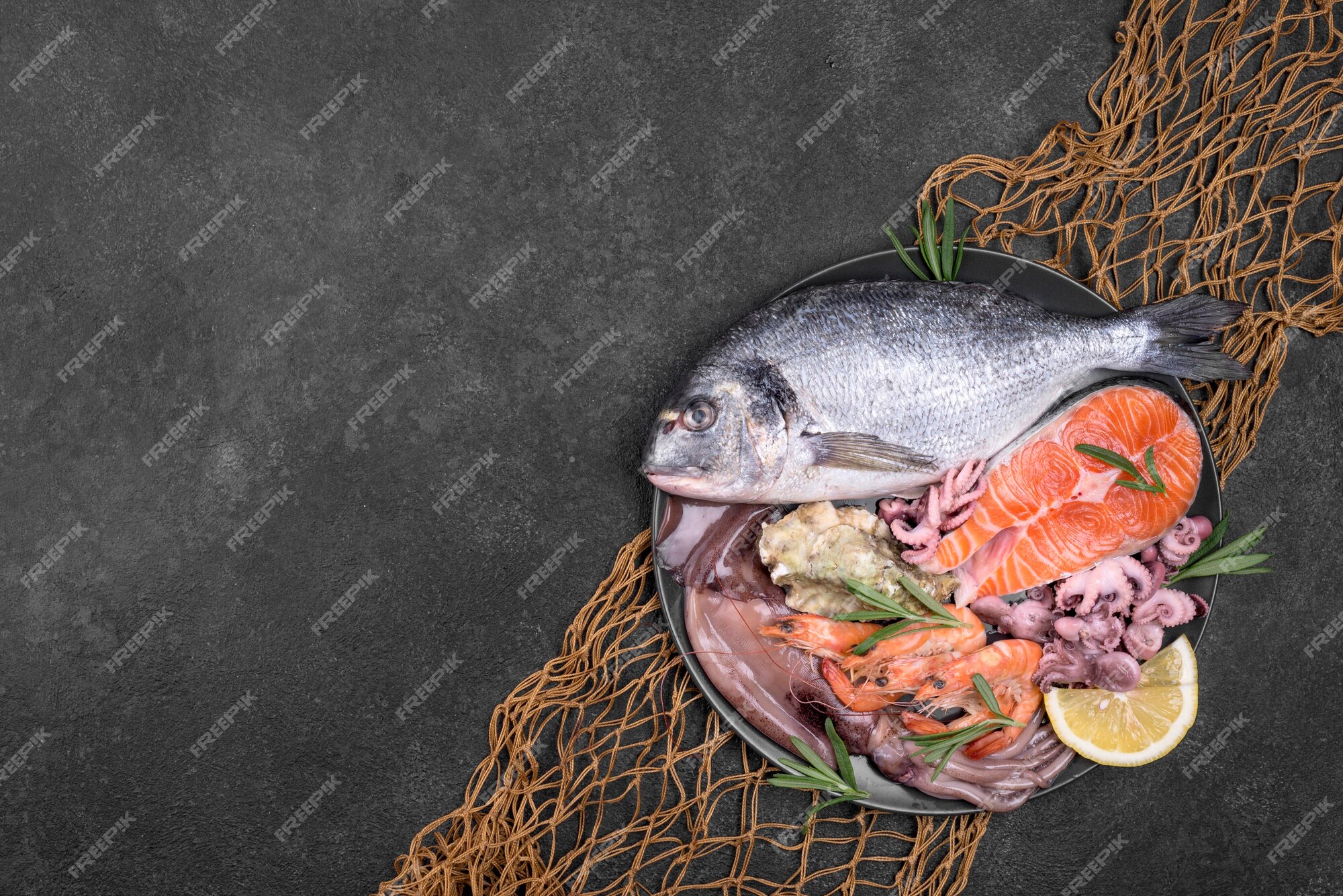 Premium Photo | Exotic seafood dish in a plate and fish net