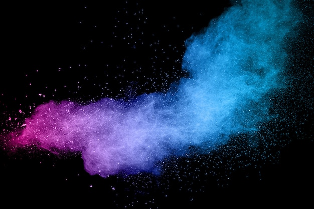 Explosion Of Color Powder On Black Background Splash Of Color Powder Dust On Dark Background Premium Photo
