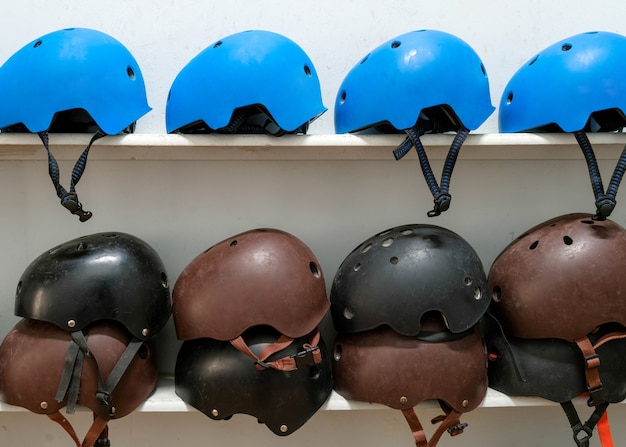 Premium Photo Extreme Sport Helmets On The Shelf