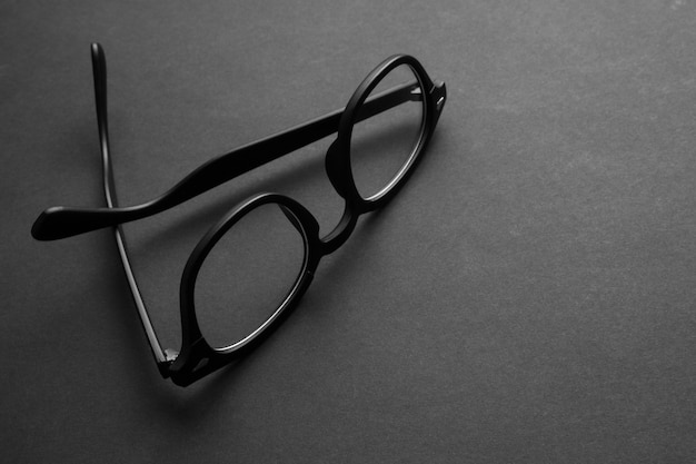 Premium Photo | Eyeglasses on black background