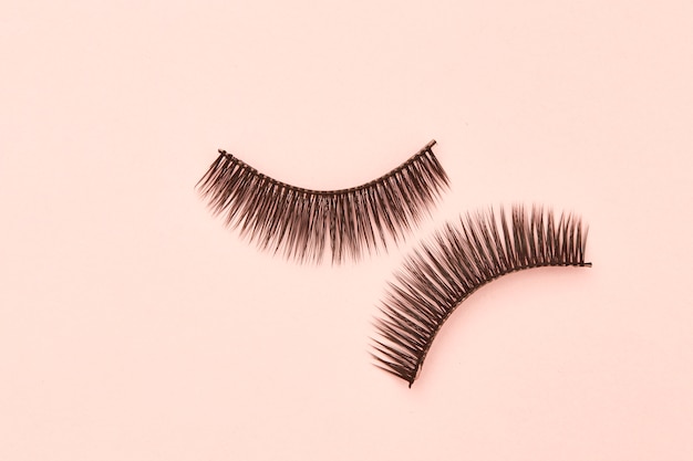 Premium Photo | Eyelashes are on pink background