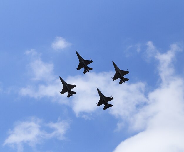 Premium Photo F Falcon Fighter Jet Flying On Blue Sky