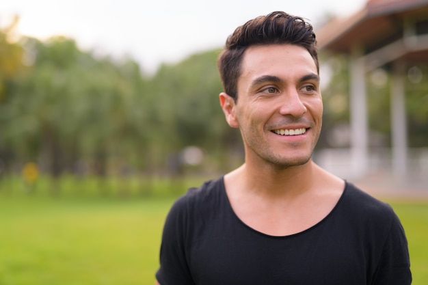 Premium Photo | Face of happy young handsome hispanic man thinking at ...