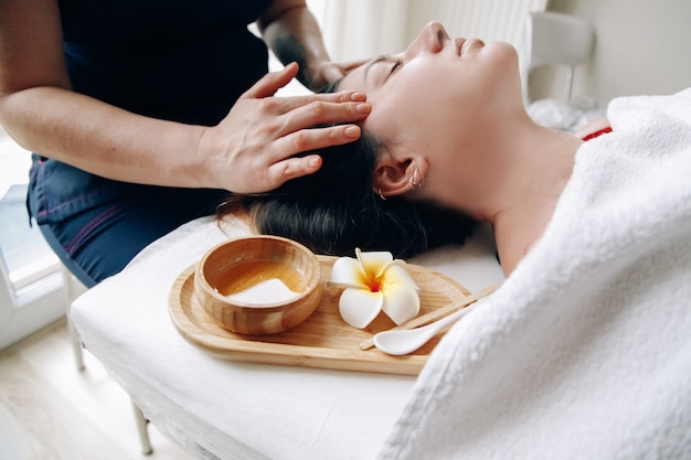Premium Photo Facial Massage Closeup Of A Woman Face Massage Therapist Doing Facial Massage To