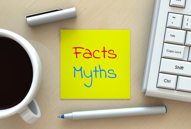 Facts myths, message on note paper, computer and coffee on table, 3d rendering Premium Photo