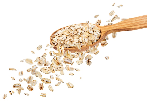 Premium Photo | Falling oat flakes isolated on white wall