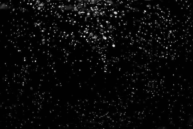 Falling snow down on the black background Photo | Premium Download