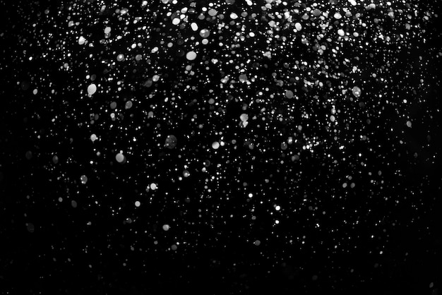 Premium Photo | Falling snow down on the black background