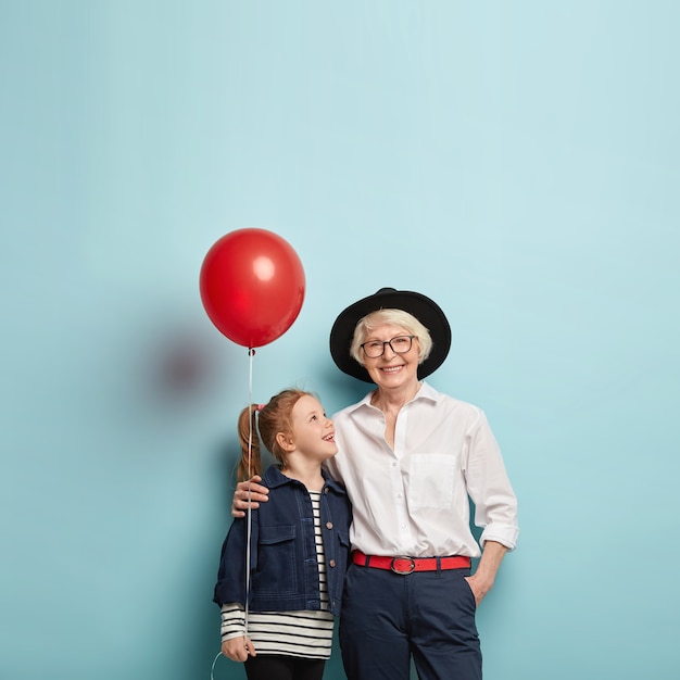 Mature granny pics free Free Photo Family Celebration Concept Cute Red Haired Girl Congratulates Mature Granny With Mothers Day Holds Red Air Balloon Embrace Together Isolated Over Blue Wall With Blank Space