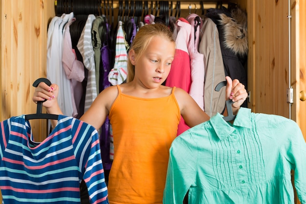 Premium Photo | Family,child in front of her closet or wardrobe