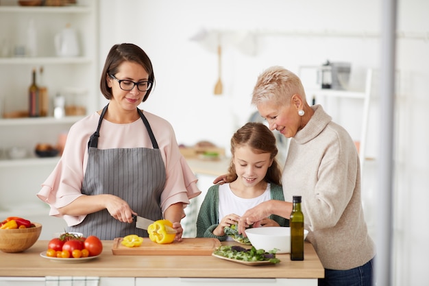 Premium Photo | Family cooking dinner together