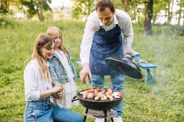 Family doing a barbecue in nature Free Photo