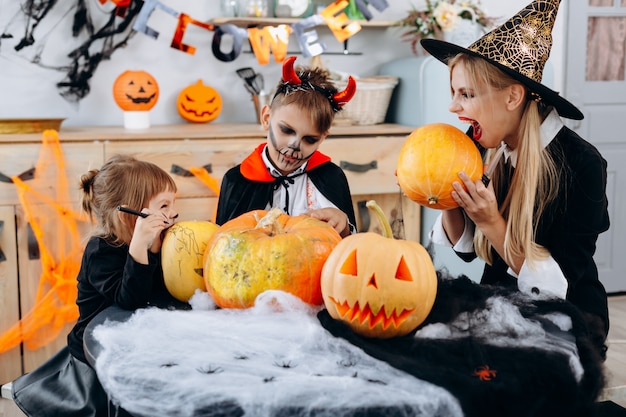 Family have funny time at home. mother and daughter celebrating Halloween at home