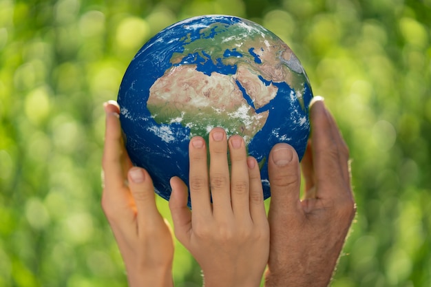Premium Photo Family Holding 3d Planet In Hands Earth Glove Save Our Planet