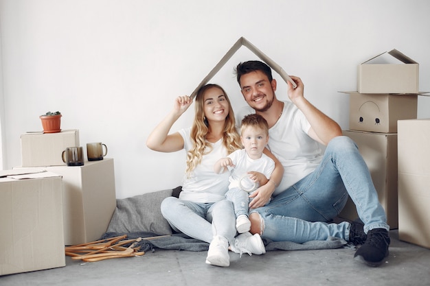 Family moving and using boxes Free Photo