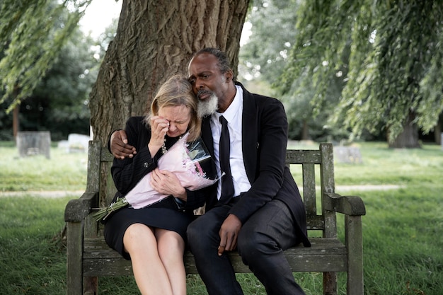 Free Photo | Family Visiting Grave Of Loved One