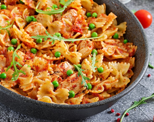 Premium Photo Farfalle Pasta With Chicken Fillet Tomato Sauce And