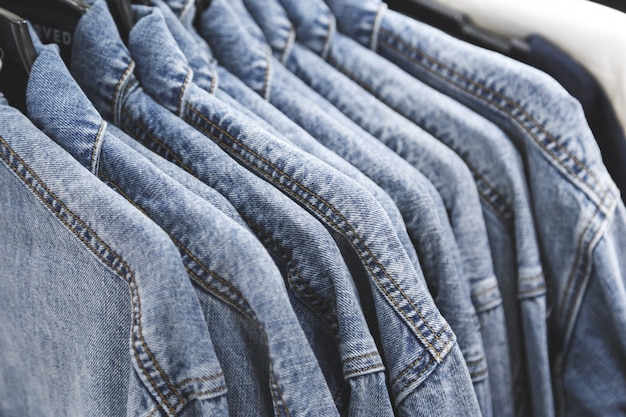 Premium Photo | Fashion jeans jacket on hangers.