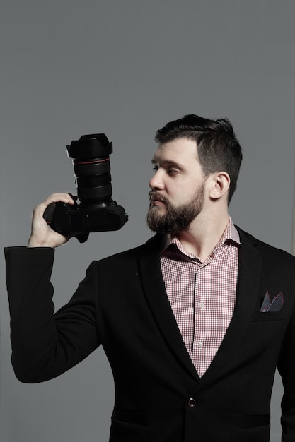 Premium Photo | Fashion photographer in a suit with a camera.photo with ...