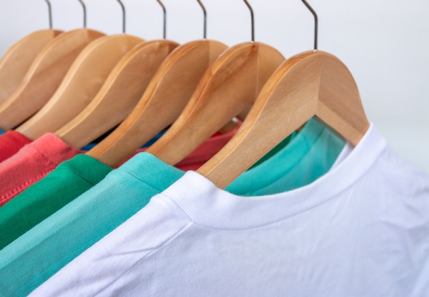 Premium Photo | Fashion t-shirt on clothing rack - closeup of bright ...