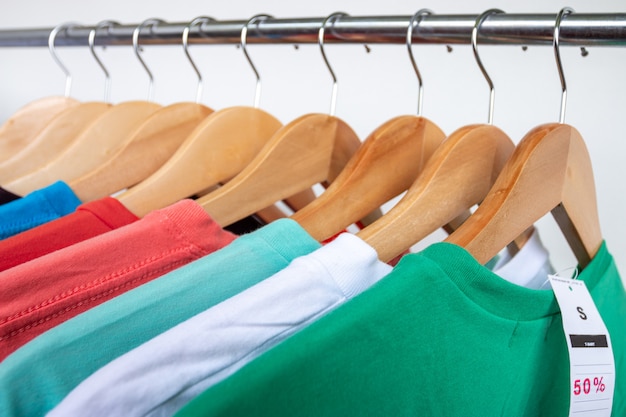 Premium Photo | Fashion t-shirt on clothing rack - closeup of bright ...